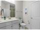 Bright bathroom featuring a white vanity, toilet, and a tiled shower at 3087 Mountain Shadow Way, Marietta, GA 30064