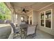 Inviting covered patio featuring string lights and a ceiling fan, perfect for outdoor dining and entertaining at 3087 Mountain Shadow Way, Marietta, GA 30064