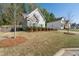Well-kept lawn and shrubs frame the exterior of a craftsman style home at 3087 Mountain Shadow Way, Marietta, GA 30064