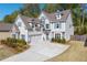 Stunning two-story home with attached garage, stone accents, and manicured landscaping at 3087 Mountain Shadow Way, Marietta, GA 30064