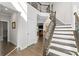 Bright foyer with hardwood floors, staircase, and iron balusters, creating a welcoming entrance at 3087 Mountain Shadow Way, Marietta, GA 30064