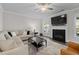 Cozy living room features a fireplace, mounted television, and comfortable seating at 3087 Mountain Shadow Way, Marietta, GA 30064