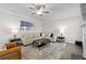 Stylish living room boasts a plush sectional sofa, modern decor, and a ceiling fan at 3087 Mountain Shadow Way, Marietta, GA 30064
