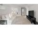 Bright living room with plush white sofa and modern entertainment center at 3087 Mountain Shadow Way, Marietta, GA 30064