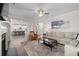 Open-concept living room flows into the kitchen with stainless steel appliances and bar seating at 3087 Mountain Shadow Way, Marietta, GA 30064