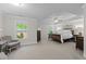 Spacious main bedroom with tray ceilings, sitting area, and ample natural light at 3087 Mountain Shadow Way, Marietta, GA 30064