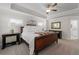 Comfortable main bedroom with a tray ceiling, neutral decor, and access to the en-suite bathroom at 3087 Mountain Shadow Way, Marietta, GA 30064