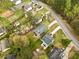 Overhead view of residential properties showcasing yards, driveways, and neighborhood layout at 4540 Bryant Rd, Buford, GA 30518
