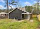 Cozy backyard featuring a dark wood paneled house with a fenced yard at 4540 Bryant Rd, Buford, GA 30518