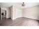 Spacious bedroom with wood floors, a wicker ceiling fan, and a double door closet at 4540 Bryant Rd, Buford, GA 30518