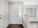 Bright entryway featuring a white front door and a view into the living space at 4540 Bryant Rd, Buford, GA 30518