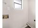 Small laundry room with wood-look floors, a window, and washer/dryer hookups at 4540 Bryant Rd, Buford, GA 30518