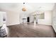 Spacious living room with wood-look flooring, stone fireplace, open floor plan into kitchen and dining areas at 4540 Bryant Rd, Buford, GA 30518