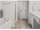 Clean bathroom with a tub, shower, and white vanity with storage at 1680 Fair Oak Way # 24, Mableton, GA 30126