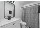 Well-lit bathroom features sleek vanity, modern fixtures, and patterned shower curtain at 1680 Fair Oak Way # 24, Mableton, GA 30126