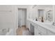 Bright bathroom featuring double sinks, white cabinets, and a separate tub and shower at 1680 Fair Oak Way # 24, Mableton, GA 30126