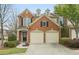 Charming red brick home featuring a two-car garage and manicured landscaping at 1680 Fair Oak Way # 24, Mableton, GA 30126
