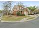 Beautiful brick townhome featuring a two-car garage, well-maintained landscaping, and classic architectural details at 1680 Fair Oak Way # 24, Mableton, GA 30126
