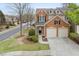 Charming two-story brick home featuring a two-car garage and manicured landscaping at 1680 Fair Oak Way # 24, Mableton, GA 30126