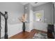 Bright foyer featuring hardwood floors, white wainscoting, and a decorative vase at 1680 Fair Oak Way # 24, Mableton, GA 30126
