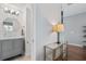Hallway with a view of a half bath and a console table with a lamp at 1680 Fair Oak Way # 24, Mableton, GA 30126