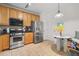 Functional kitchen with stainless steel appliances, wood cabinets, and breakfast nook at 1680 Fair Oak Way # 24, Mableton, GA 30126