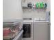 Functional laundry room with shelving, washer, and dryer at 1680 Fair Oak Way # 24, Mableton, GA 30126