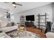 Stylish living room with hardwood floors, modern shelving, and comfortable sofa at 1680 Fair Oak Way # 24, Mableton, GA 30126