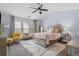 Spacious main bedroom with a large window, ceiling fan, and sitting area at 1680 Fair Oak Way # 24, Mableton, GA 30126