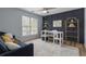 Stylish home office featuring a large window, modern furniture, and elegant décor at 1680 Fair Oak Way # 24, Mableton, GA 30126