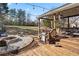 Outdoor living space with a large back deck, patio, fire pit, and spacious yard for entertaining at 2230 Mcbrayer Ct, Cumming, GA 30028
