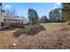 Expansive backyard with a covered patio, offering plenty of room for outdoor activities and relaxation at 2230 Mcbrayer Ct, Cumming, GA 30028