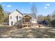 Spacious backyard with deck, patio, and fenced perimeter at 2230 Mcbrayer Ct, Cumming, GA 30028