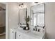 Modern bathroom features a dual sink vanity with black fixtures at 2230 Mcbrayer Ct, Cumming, GA 30028
