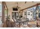Covered deck with dining area and outdoor seating at 2230 Mcbrayer Ct, Cumming, GA 30028