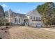 Inviting home exterior featuring a two-car garage, well-maintained lawn, and traditional architectural style at 2230 Mcbrayer Ct, Cumming, GA 30028