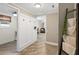 Hallway leading to laundry and office features unique hanging rack at 2230 Mcbrayer Ct, Cumming, GA 30028