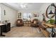 Comfortable home office with leather chairs and ample natural light at 2230 Mcbrayer Ct, Cumming, GA 30028