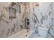 Bathroom with marble tile accent wall, soaking tub, and modern fixtures at 3068 Turning Creek Trail, Dacula, GA 30019