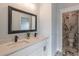 Modern bathroom with double vanity and marble-tiled toilet room at 3068 Turning Creek Trail, Dacula, GA 30019