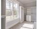 Walk-in closet with open shelving, drawers, and natural light from a big window at 3068 Turning Creek Trail, Dacula, GA 30019