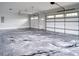 Spacious garage with stylish epoxy flooring, natural light and two car capacity at 3068 Turning Creek Trail, Dacula, GA 30019