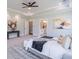 An expansive main bedroom features a tray ceiling with rope lighting, carpet floors, and ensuite access at 3068 Turning Creek Trail, Dacula, GA 30019