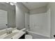 Clean, functional bathroom with classic white fixtures and a neutral color scheme at 4463 Grove Lake St, Loganville, GA 30052