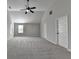 Large bedroom with gray carpet, bright colors, vaulted ceilings and a ceiling fan at 4463 Grove Lake St, Loganville, GA 30052