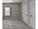 Spacious bedroom featuring two closets and ample natural light at 4463 Grove Lake St, Loganville, GA 30052