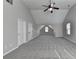 Bright bonus room boasts vaulted ceilings, plush carpet and lots of natural light at 4463 Grove Lake St, Loganville, GA 30052