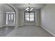 Neutral dining room with carpeted flooring and natural light at 4463 Grove Lake St, Loganville, GA 30052