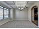Bright dining room featuring coffered ceilings, neutral paint, and large windows at 4463 Grove Lake St, Loganville, GA 30052