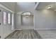 Spacious foyer with a two-story ceiling, hardwood flooring, and an arched entryway to the living area at 4463 Grove Lake St, Loganville, GA 30052